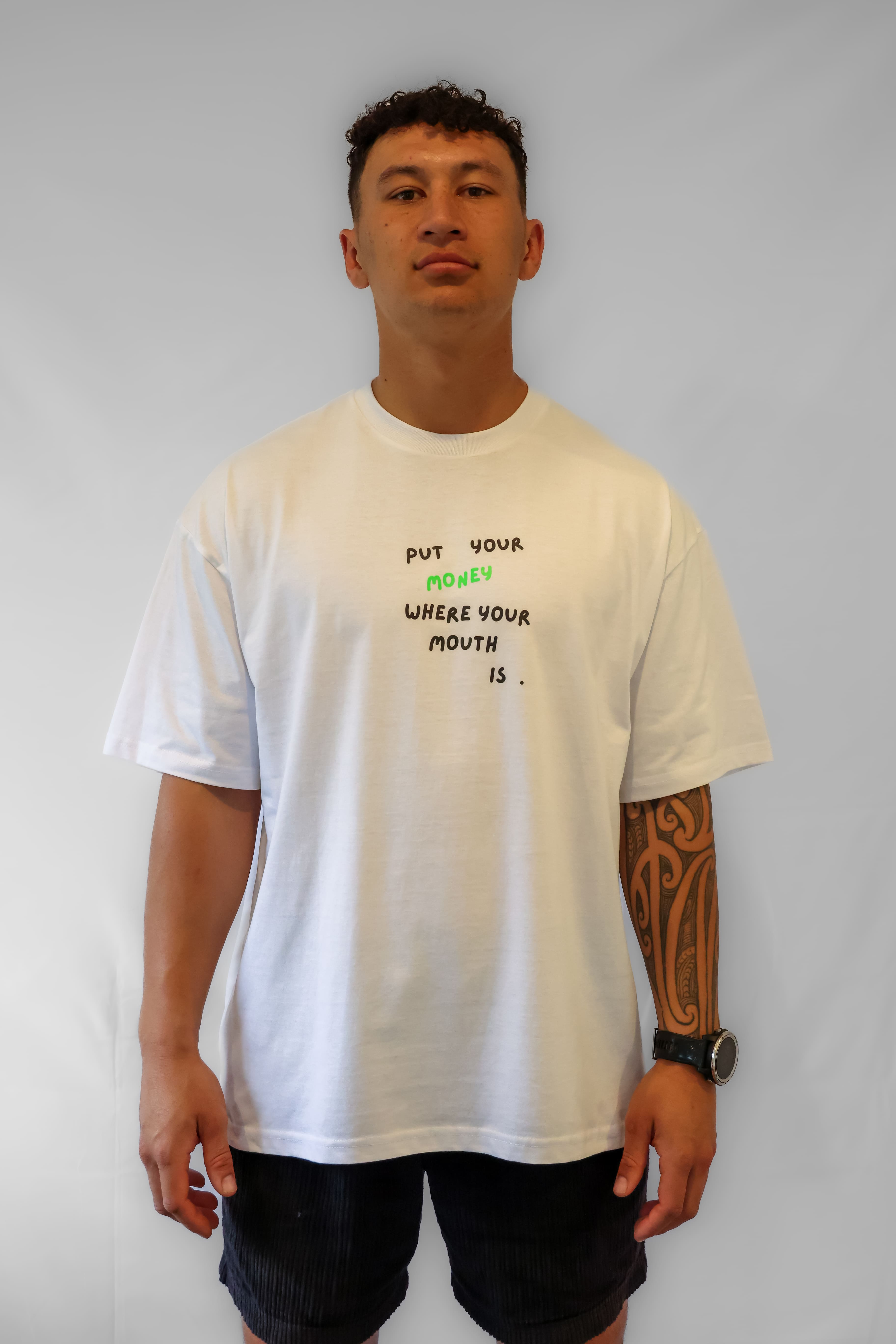 Person wearing a white Winr Statement oversized t-shirt with text graphic, streetwear tee against a plain background